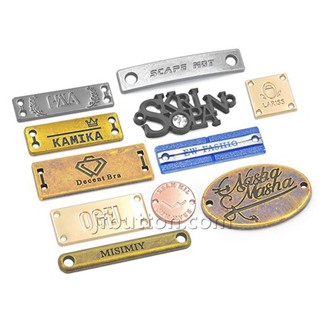Etiquetes de logotip de metall