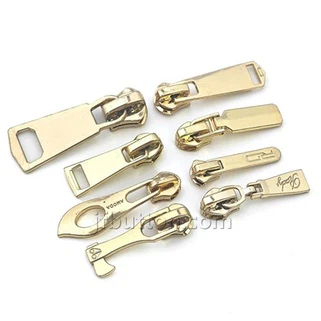 Tirador de cremallera daurat